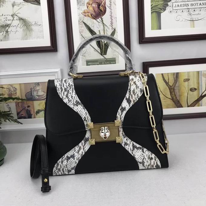  Gucci Leather and snakeskin top handle bag